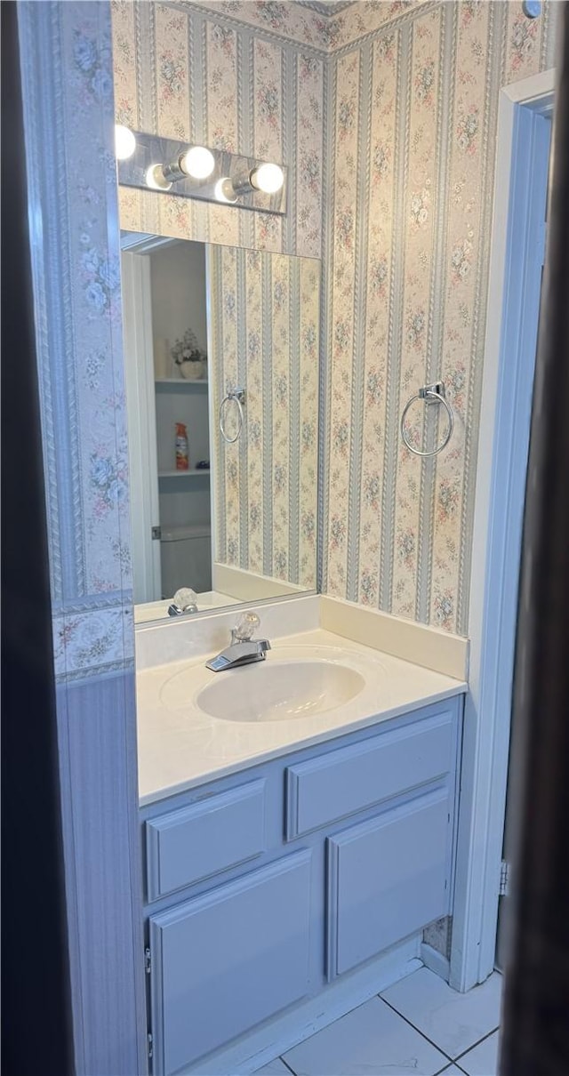 bathroom featuring vanity, built in features, and tile patterned floors