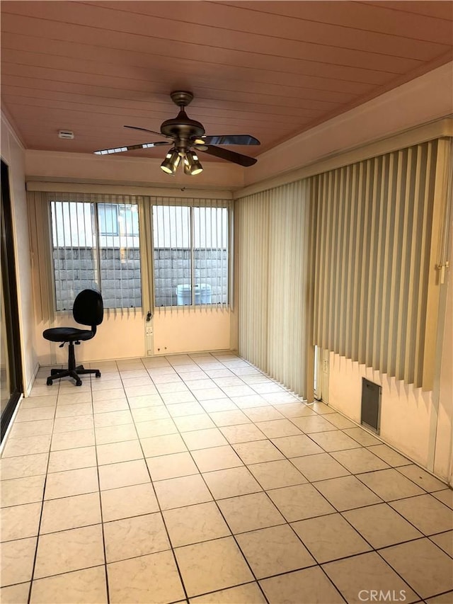 unfurnished sunroom with ceiling fan and wooden ceiling