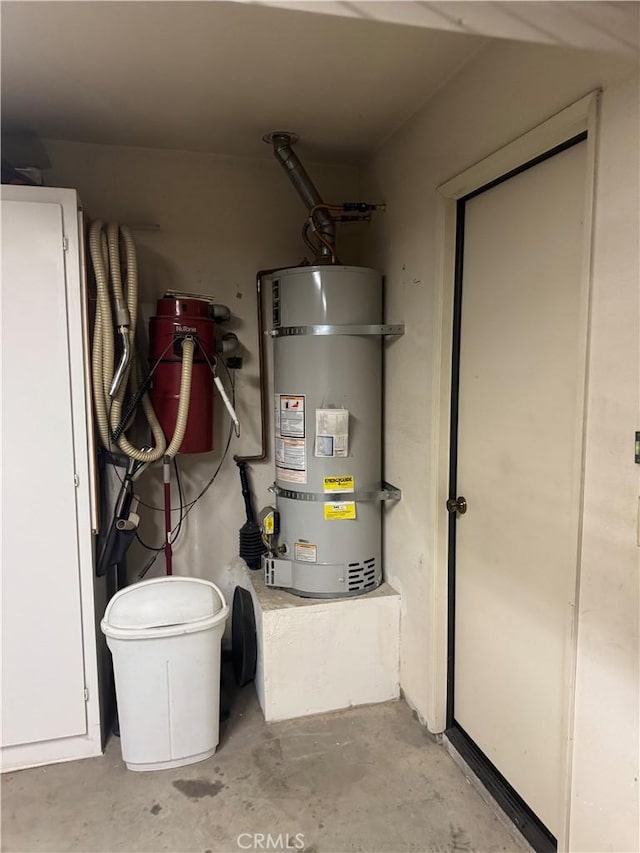 utility room featuring secured water heater