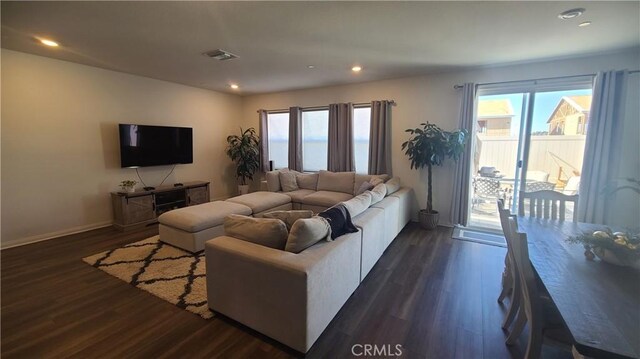 living room with dark hardwood / wood-style floors