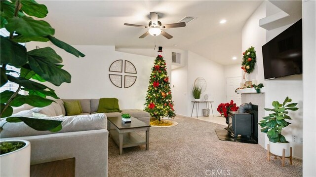 living room featuring vaulted ceiling, ceiling fan, and carpet floors