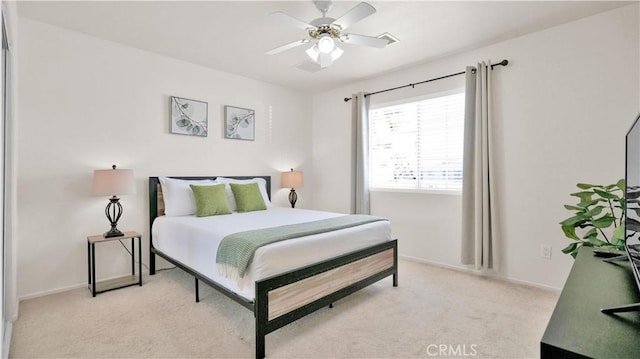 bedroom featuring light carpet and ceiling fan