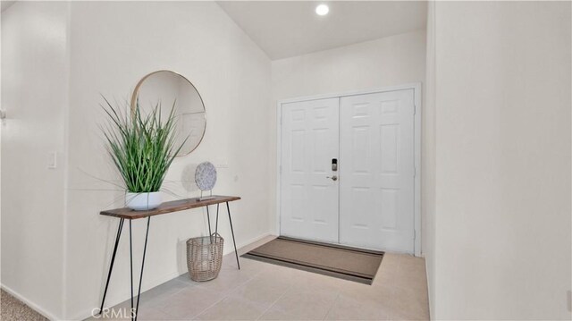 foyer with light tile patterned floors