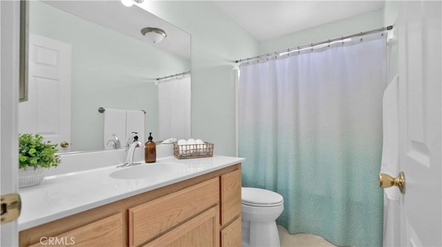 bathroom with toilet and vanity