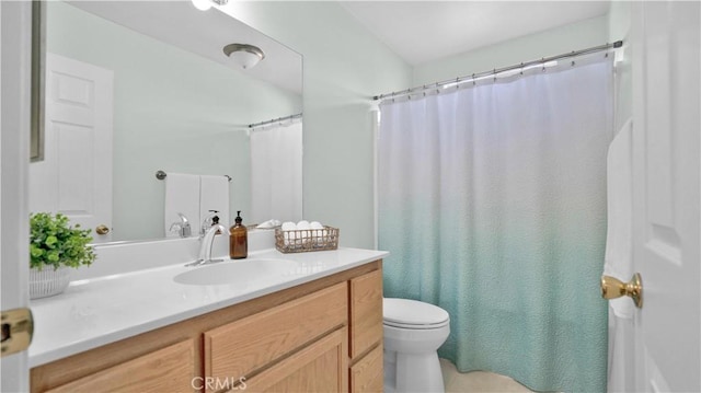 bathroom featuring toilet and vanity