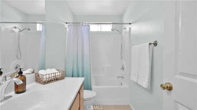 full bathroom featuring toilet, vanity, and shower / bath combo with shower curtain