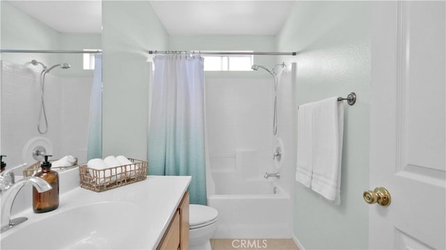 full bathroom featuring toilet, vanity, and shower / tub combo with curtain