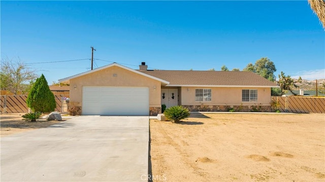 ranch-style house featuring a garage