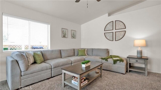 living room featuring ceiling fan, light carpet, and vaulted ceiling