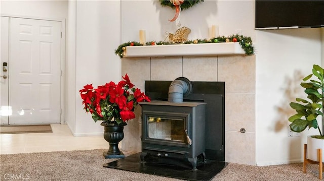 room details with a wood stove and carpet