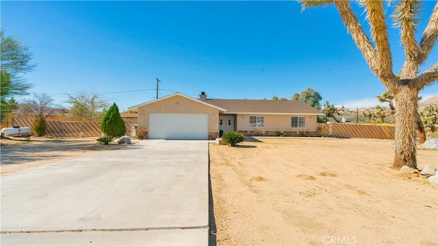 single story home featuring a garage