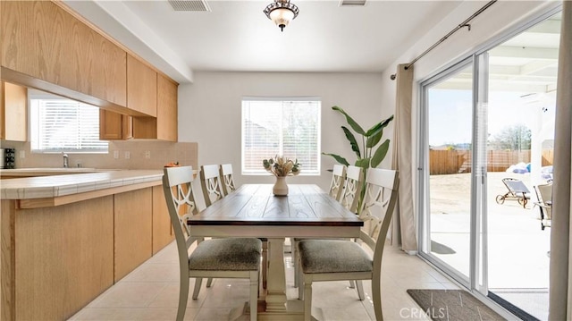 dining room featuring light tile patterned floors