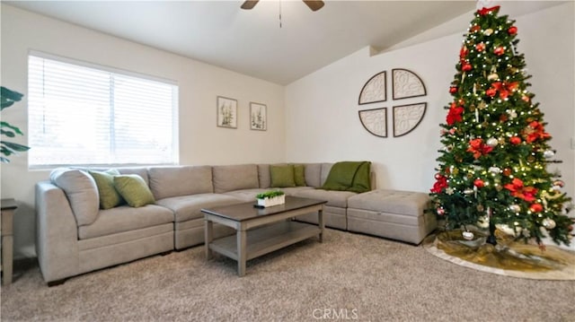 carpeted living room featuring ceiling fan and vaulted ceiling