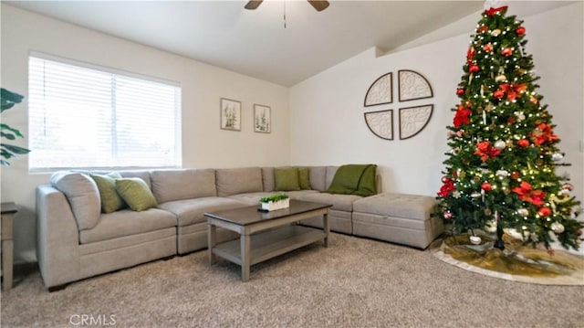 living room with ceiling fan, light colored carpet, and lofted ceiling