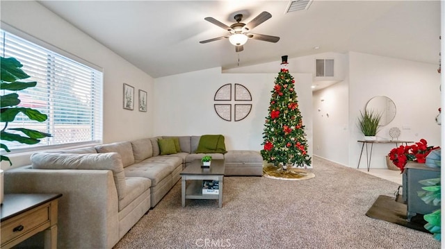 living room featuring light carpet, vaulted ceiling, and ceiling fan