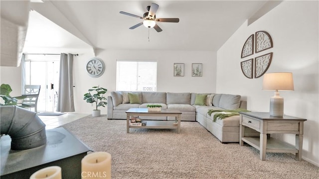 living room featuring ceiling fan and light colored carpet