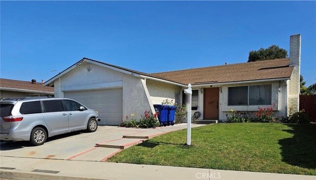 single story home featuring a front yard and a garage