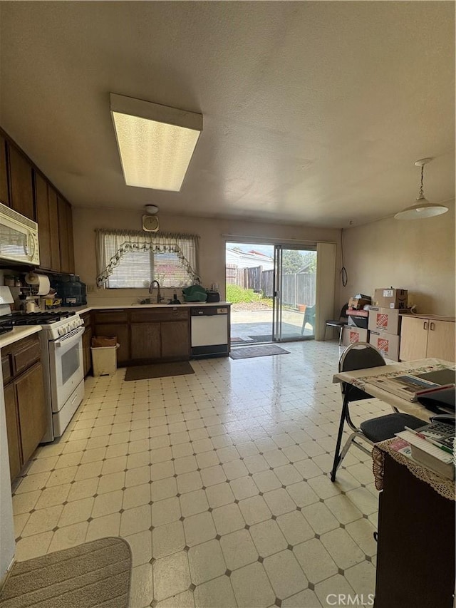 kitchen featuring sink and white appliances