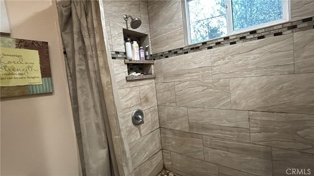 bathroom featuring a shower with curtain