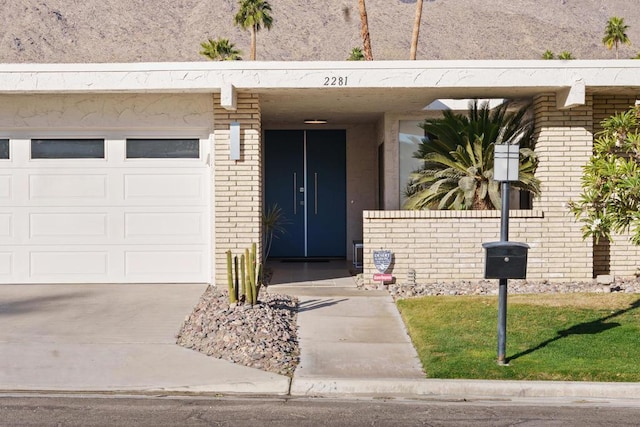 view of exterior entry with a garage