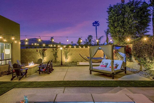 patio terrace at dusk with a fire pit