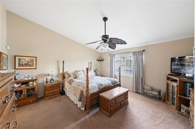 bedroom with ceiling fan, lofted ceiling, and carpet floors