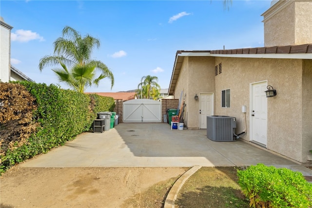 view of side of property featuring central AC unit