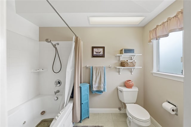 bathroom featuring toilet, tile patterned floors, and shower / tub combo with curtain