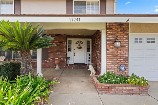 property entrance featuring covered porch