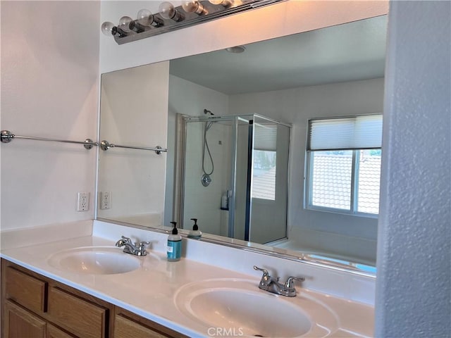 bathroom with vanity and independent shower and bath