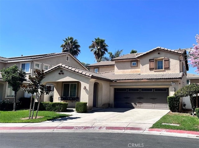 mediterranean / spanish house featuring a garage