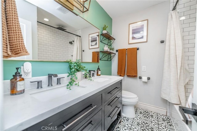 bathroom with toilet, ceiling fan, tile patterned floors, and vanity