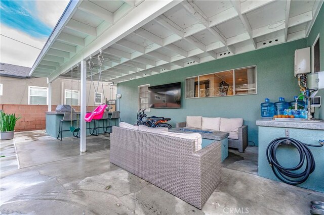 view of patio / terrace featuring sink and an outdoor hangout area