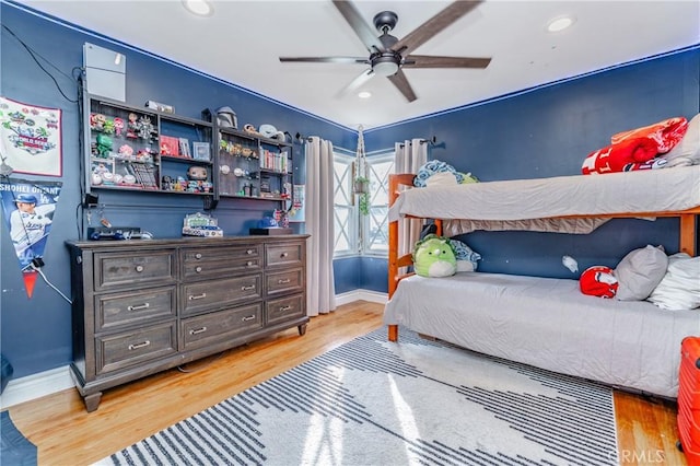 bedroom featuring ceiling fan and hardwood / wood-style flooring