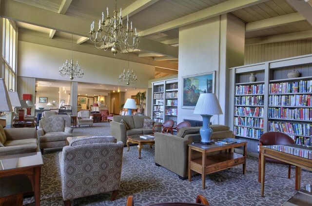 carpeted living room featuring high vaulted ceiling and beam ceiling