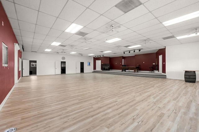 workout room featuring light hardwood / wood-style flooring