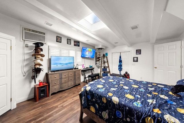 bedroom with dark hardwood / wood-style flooring and beam ceiling