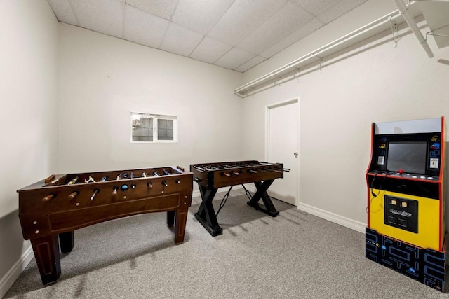 carpeted living room with a paneled ceiling