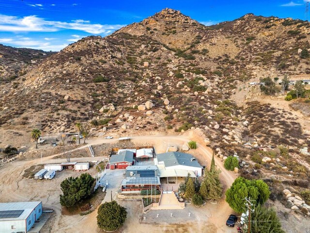 drone / aerial view featuring a mountain view