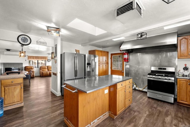 kitchen featuring a kitchen island, dark wood-type flooring, stainless steel appliances, ventilation hood, and a wall unit AC