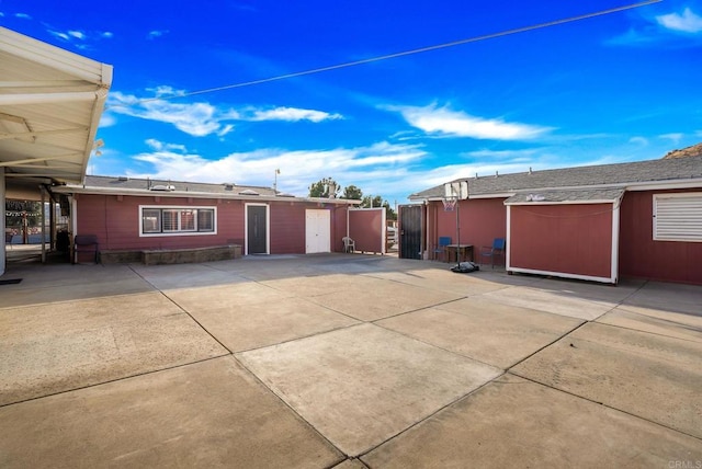 view of side of home featuring a patio area