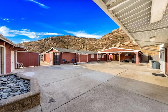 view of patio with a gazebo and a mountain view