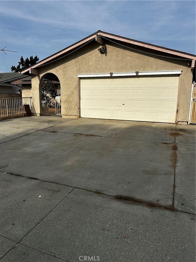 view of side of home featuring a garage