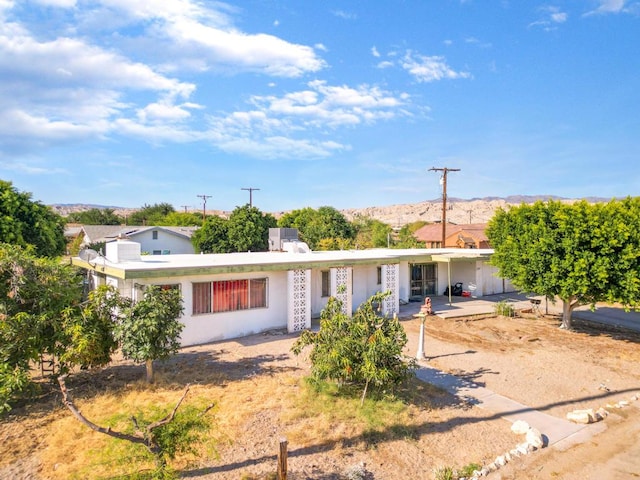 ranch-style home featuring a patio area