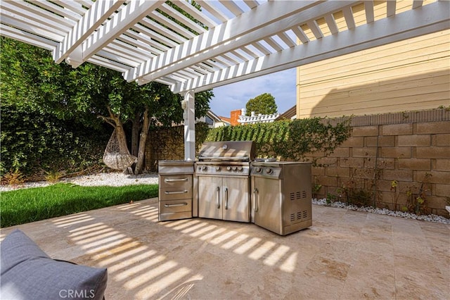 view of patio featuring a pergola, a grill, and exterior kitchen