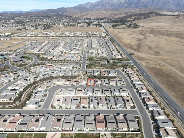 birds eye view of property with a mountain view