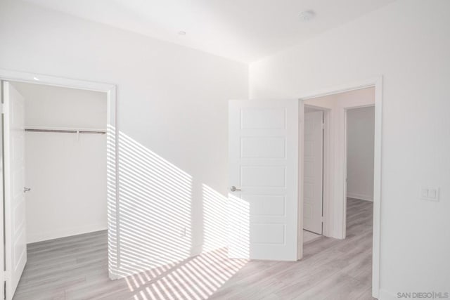 hallway featuring light wood-type flooring