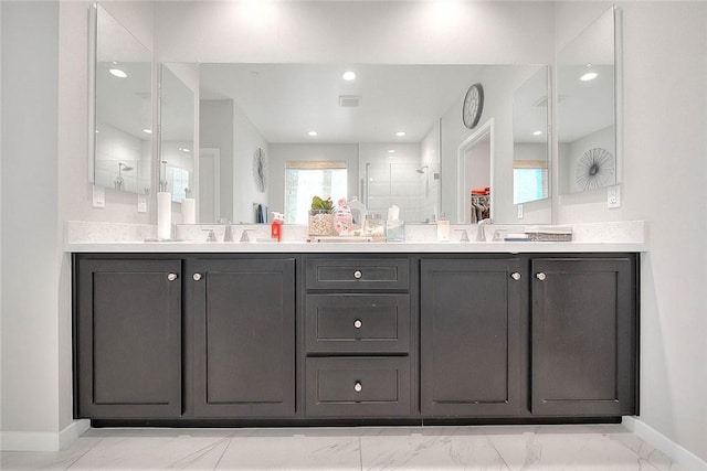 bathroom featuring walk in shower and vanity