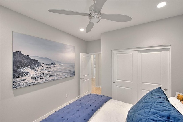 bedroom featuring ceiling fan and a closet