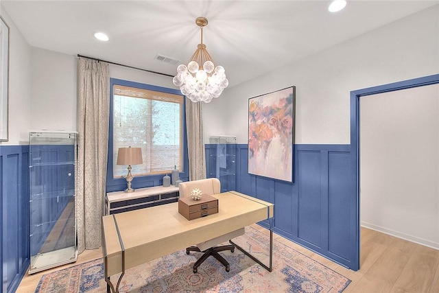 office space featuring visible vents, wainscoting, light wood-style flooring, a chandelier, and recessed lighting